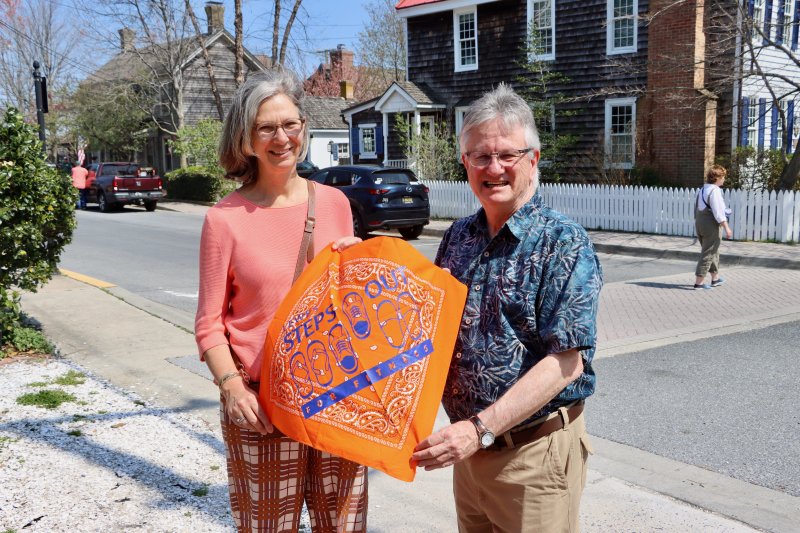 Ed Zygmonski, Lewes in Bloom co-chair, right, presents Netherlands Ambassador Birgitta Tazelaar with a bandana from the Lewes Steps Out for Fitness campaign, an initiative from the administration of then-Mayor Jim Ford. Orange is the national color of the Netherlands.